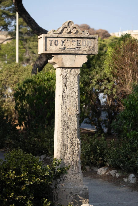 Ancient Stone Column in Garden