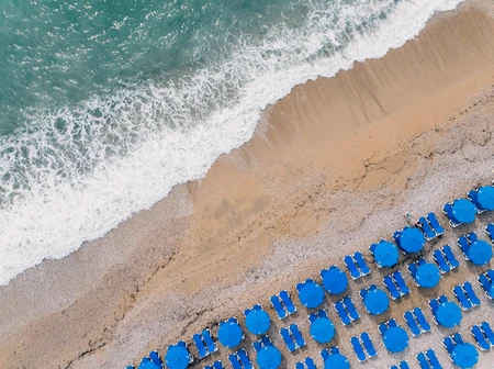 Aerial View of Beach Umbrellas by the Shore