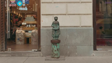 Street Statue Near Shop Entrance