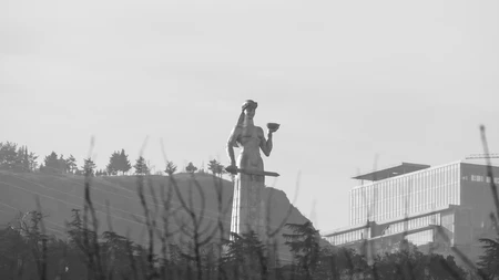 Monument in Foggy Landscape