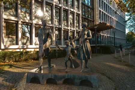 Bronze Family Sculpture in Urban Setting