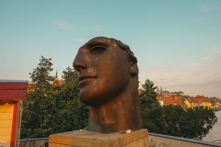 Sculptured Head With Scenic Background