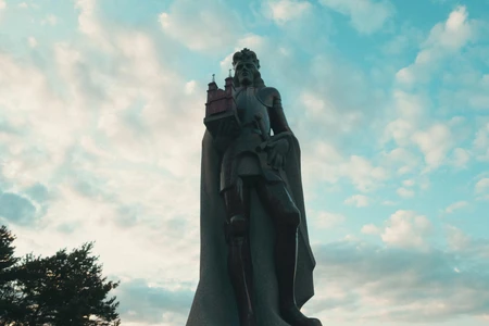 Statue Against a Cloudy Sky