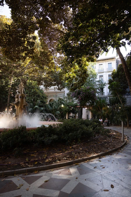 Urban Fountain in Leafy Plaza