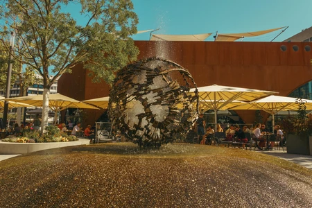 Outdoor Cafe with Artistic Fountain