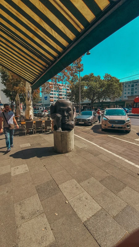 Urban Street Scene with Sculpture