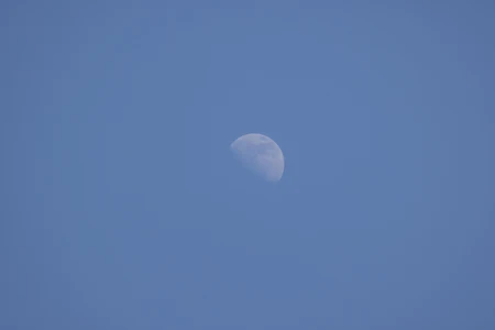 Moon in Daylight Sky