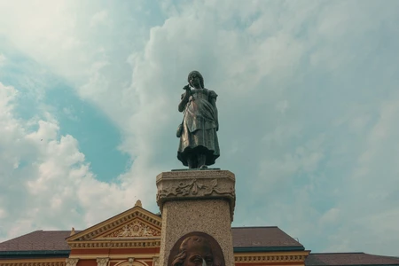 Statue and Architectural Backdrop