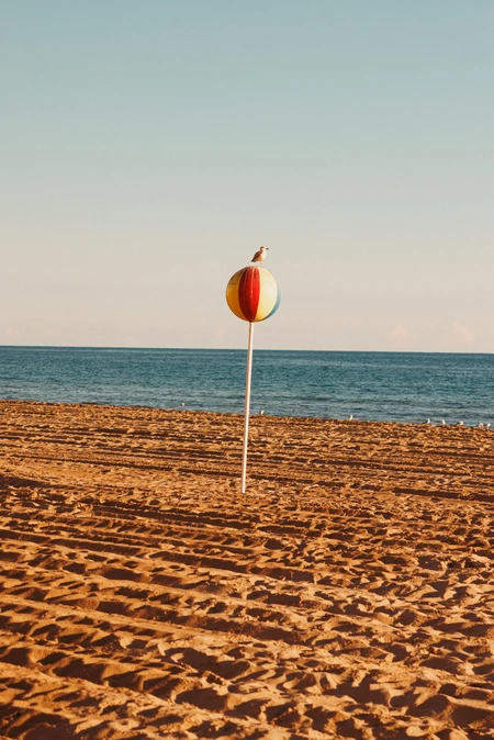 Beach Serenity with Colorful Buoy
