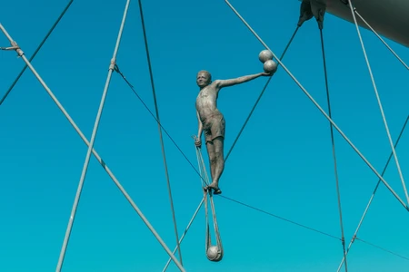 Sculpture of a Man on Tension Wires