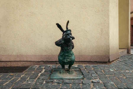 Quirky Statue on Cobbled Street