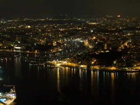 Illuminated Coastal City at Night