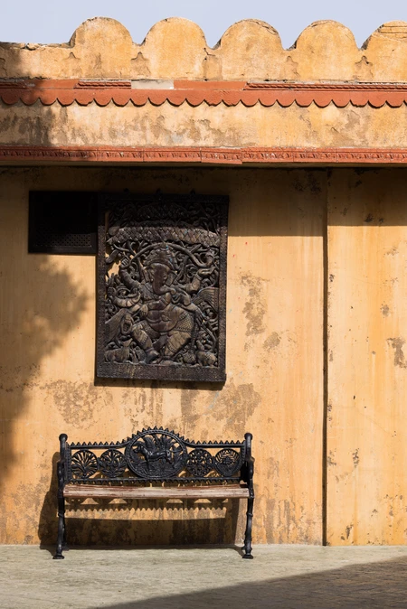Rustic Wall with Iron Bench
