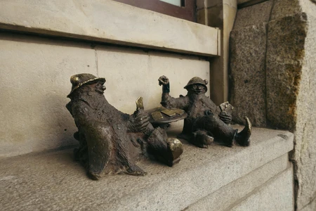 Bronze Sculptures on Stone Ledge