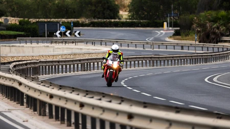 Motorcyclist on a Winding Road