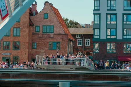 Crowded Bridge Overlooking Historic Buildings