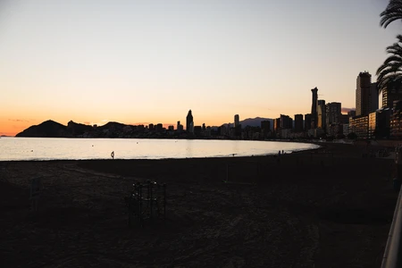 Sunset Over Coastal City Skyline