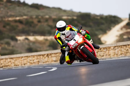Motorcycle Racing on a Scenic Road