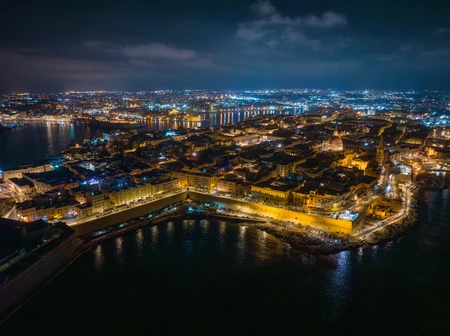 Illuminated Coastal City at Night