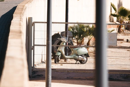 Vespa by the Fence