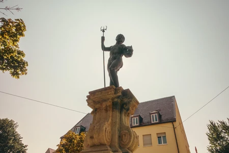 Statue in Sunlit Square