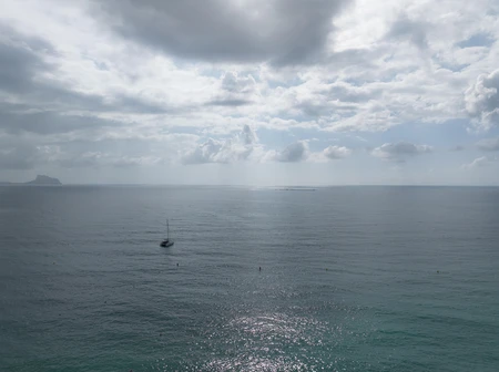 Tranquil Seascape with Sailboat