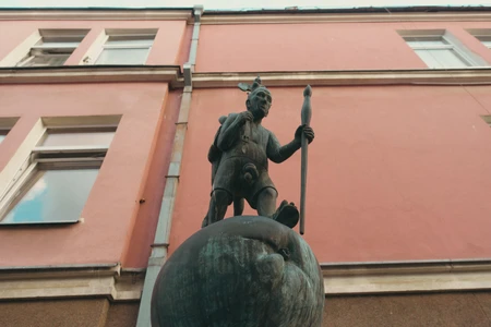 Statue Against Building Facade