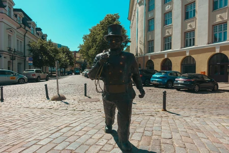 Statue on Cobblestone Street