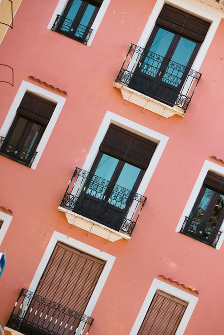 Balconies on Pink Wall