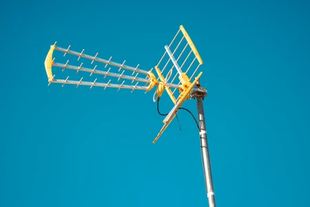 Yellow Antenna Against Blue Sky
