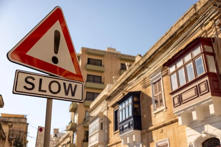 Urban Street with Slow Sign