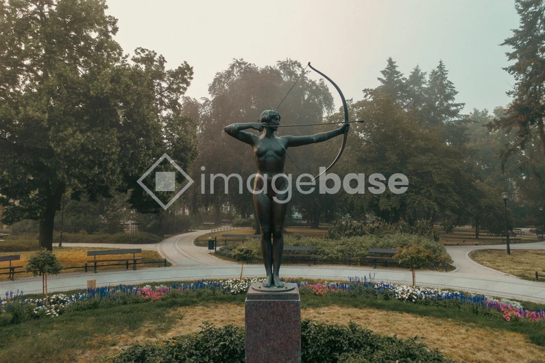 Statue in a Scenic Park