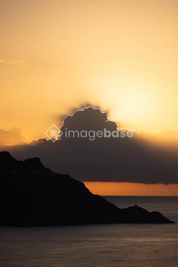 Sunset Over Silhouetted Hills