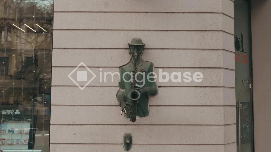 Saxophonist Sculpture on Building