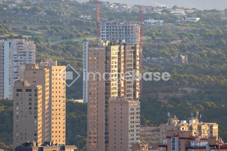 Urban Skyline with Hillside Background