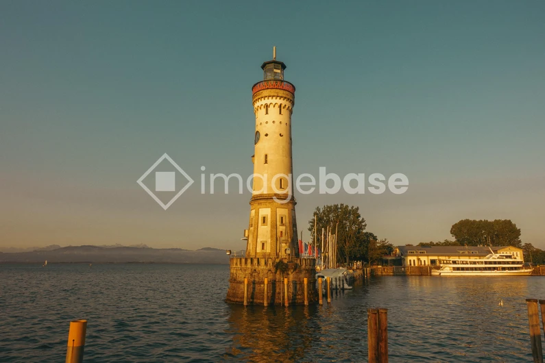 Sunlit Lighthouse by the Lake