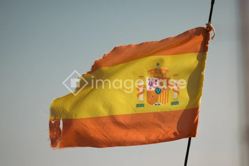Worn Spanish Flag in the Wind