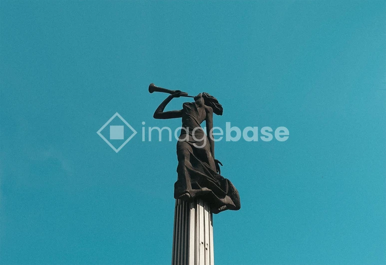 Statue Against Blue Sky