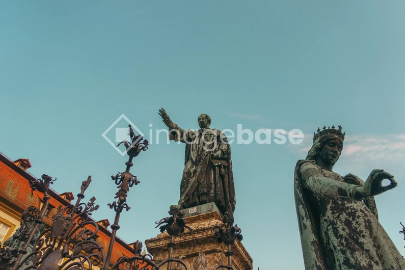 Historic Statues Against Blue Sky