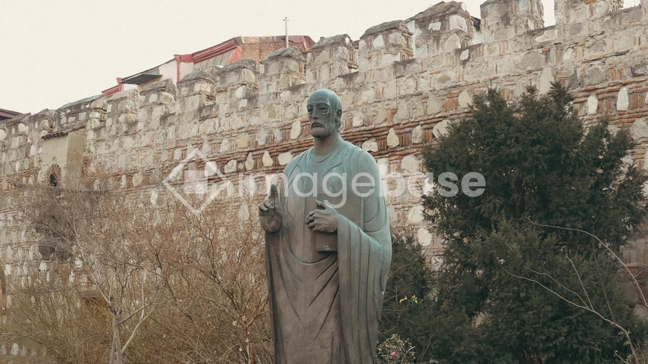 Historic Statue by Ancient Wall