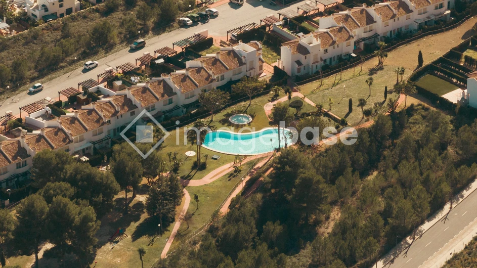 Aerial View of Residential Area with Pool