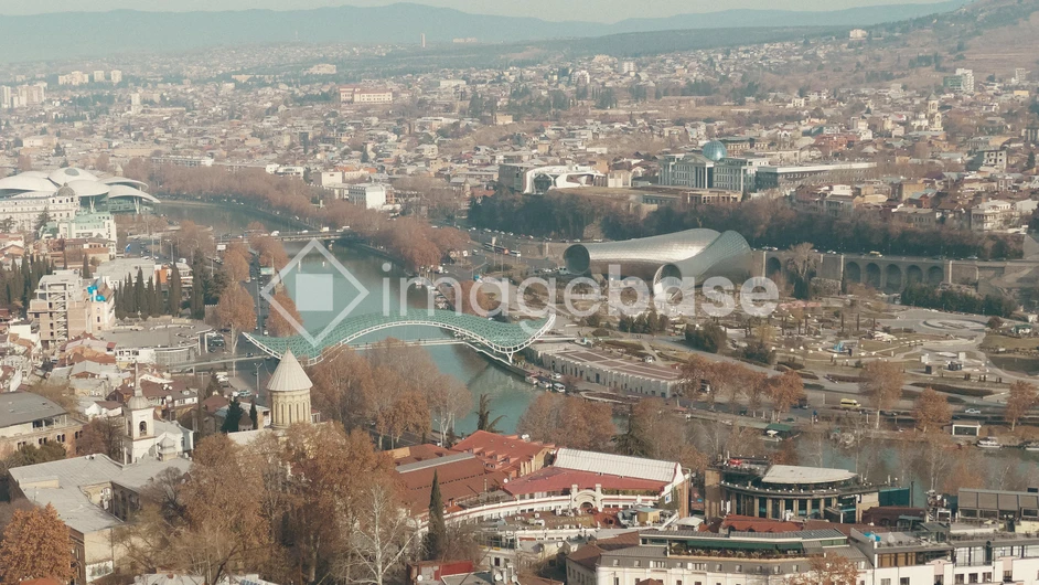 Cityscape with River and Bridge