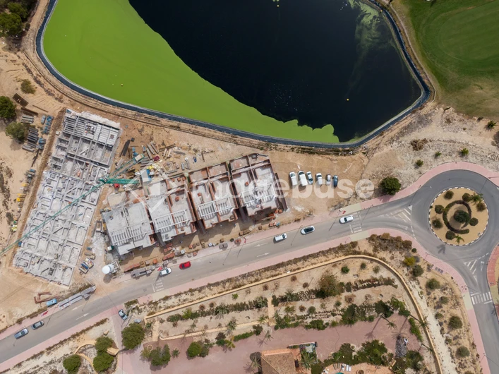 Aerial View of Construction Site by a Lake