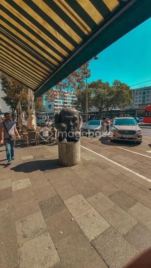 Urban Street Scene with Sculpture