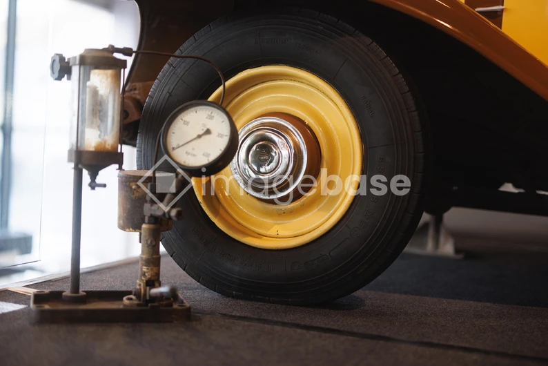Vintage Car Wheel and Gauge
