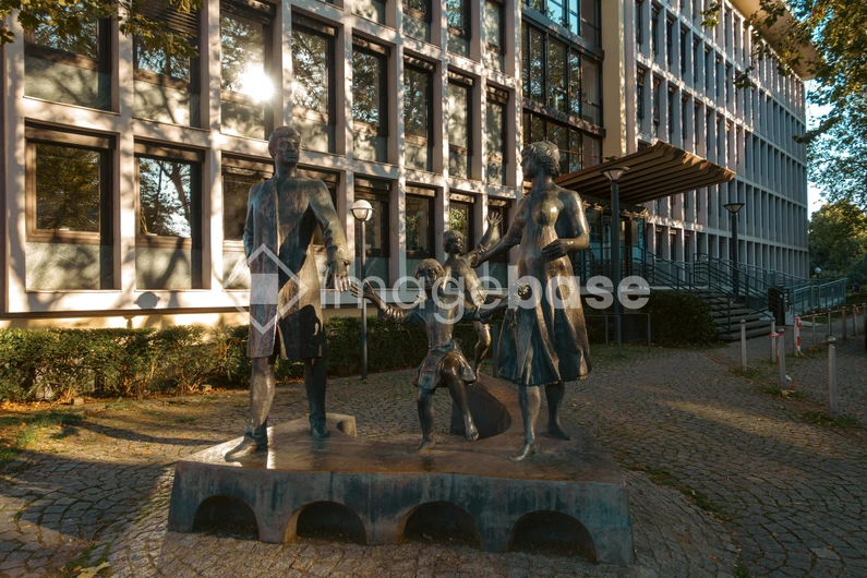 Bronze Family Sculpture in Urban Setting