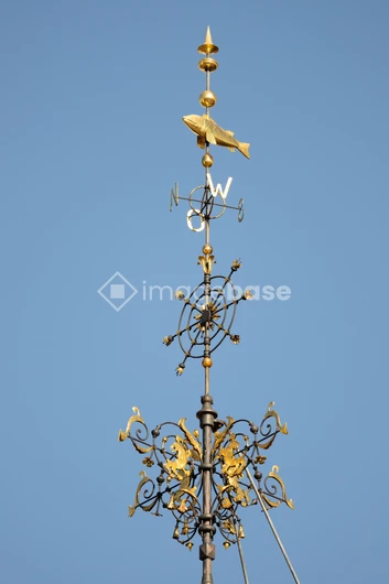 Ornate Weather Vane Against a Blue Sky