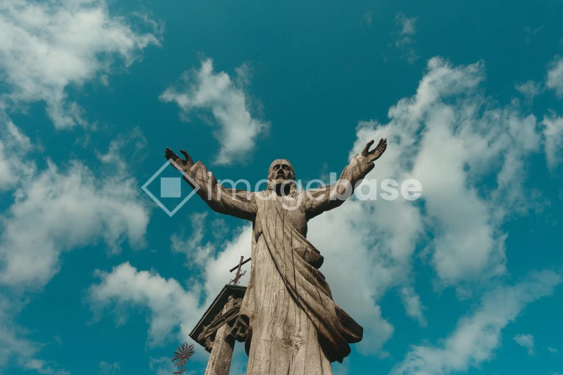 Statue with Open Arms Under Sky