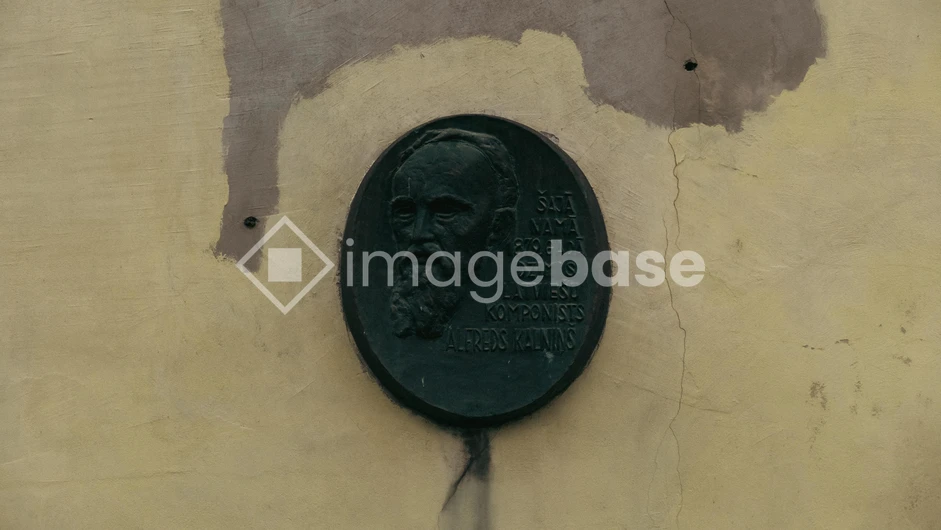 Historic Plaque on Weathered Wall