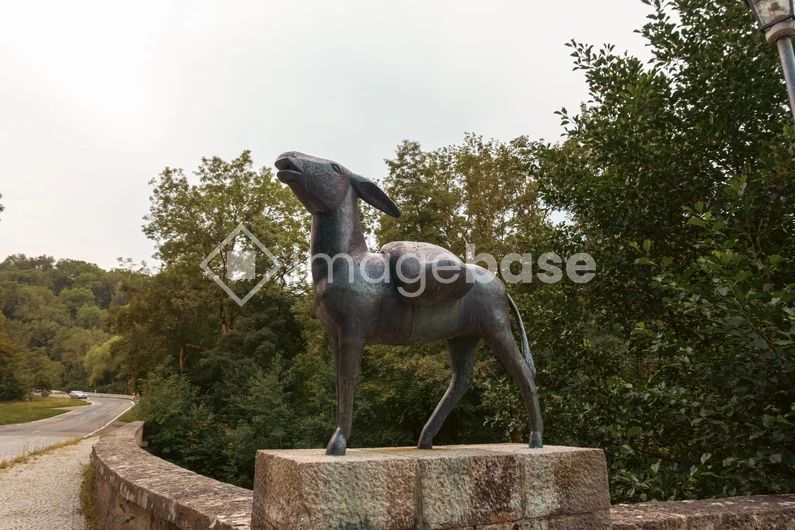 Bronze Animal Statue on Stone Pedestal